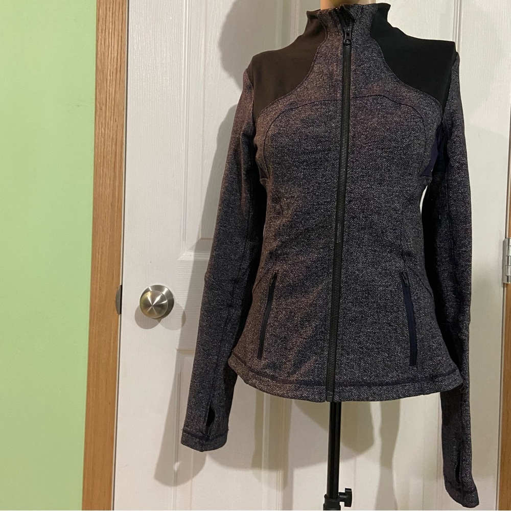 Lululemon women purple and black define fit active zip up top. Size 6. Used.